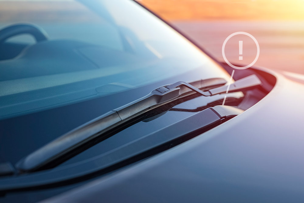Man sitting in car being handed keys