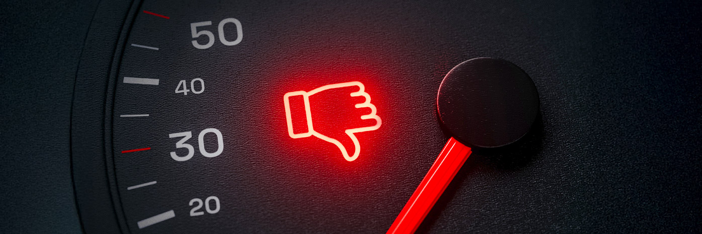 Image of a car dashboard with a thumbs down symbol